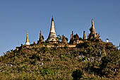 Inle Lake Myanmar. Indein, a cluster of ancient stupas  ruined and overgrown with bushes, just behind the village. 